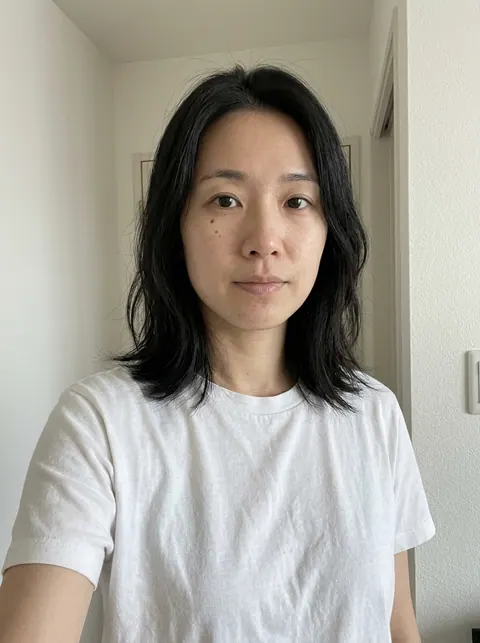 Example input: a woman with shoulder-length black hair