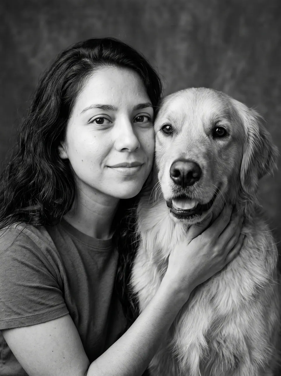 Black & White Timeless: a woman with long wavy brown hair with a golden retriever